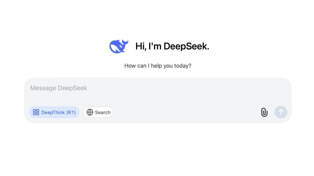 A screenshot of a chat interface with a white background. At the top, there's a blue whale icon next to the text "Hi, I'm DeepSeek. How can I help you today?" Below is a text input box labeled "Message DeepSeek" with two buttons: "DeepThink (R1)" and "Search," along with icons for attaching a file and sending a message.