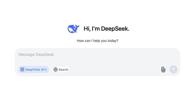A screenshot of a chat interface with a white background. At the top, there's a blue whale icon next to the text "Hi, I'm DeepSeek. How can I help you today?" Below is a text input box labeled "Message DeepSeek" with two buttons: "DeepThink (R1)" and "Search," along with icons for attaching a file and sending a message.